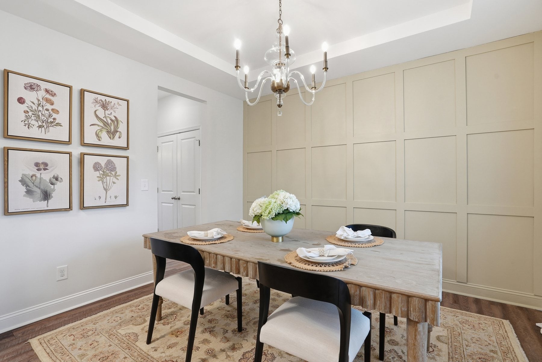 Dining room with a tray ceiling and designer accent wall at 1210 Therns Ferry Drive